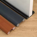 Adjustable door draft stopper installed to block cold air, dust, and noise